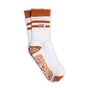 A pair of white crew socks with rust-orange accents, featuring grip dots on the sole and the letters 'IAK.' printed on the side.