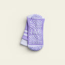 Close-up of IAK Dream grip sock sole showing full-coverage PVC grip for pilates and yoga
